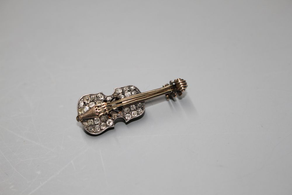 A late Victorian yellow and white metal and rose cut diamond set novelty brooch, modelled as a violin,